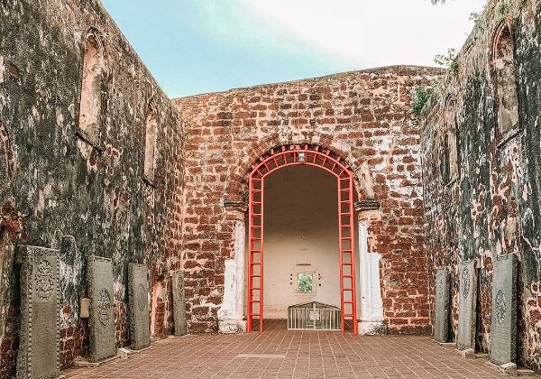 Travellers exploring colourful Malaysian heritage architecture