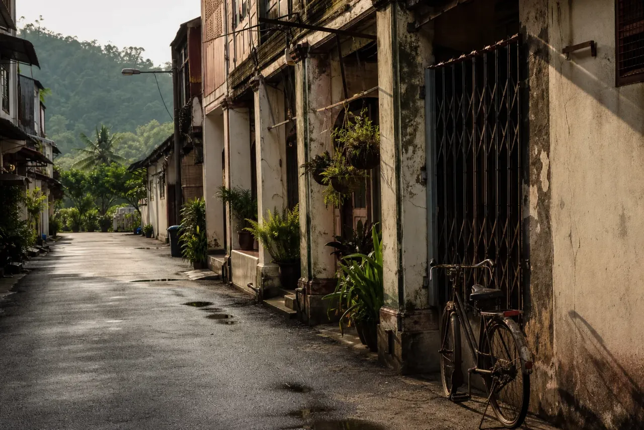 AI-generated editorial interpretation of a quiet Kluang old-town lane in late-afternoon light