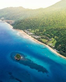 A forested coastline and calm bay at Tioman Island